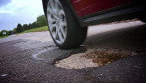 car-pothole-lrg | The Paving Experts