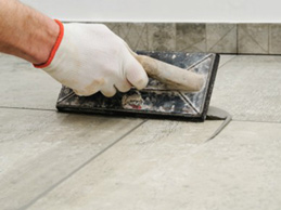 Grouting tiles indoors