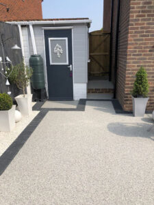 Paved home entrance with resin surfacing