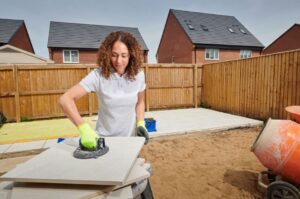 Woman laying porcelain patio