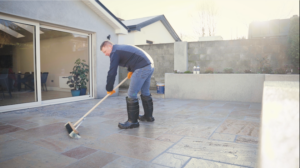 Sweeping off excess grout - Joint-It Dynamic
